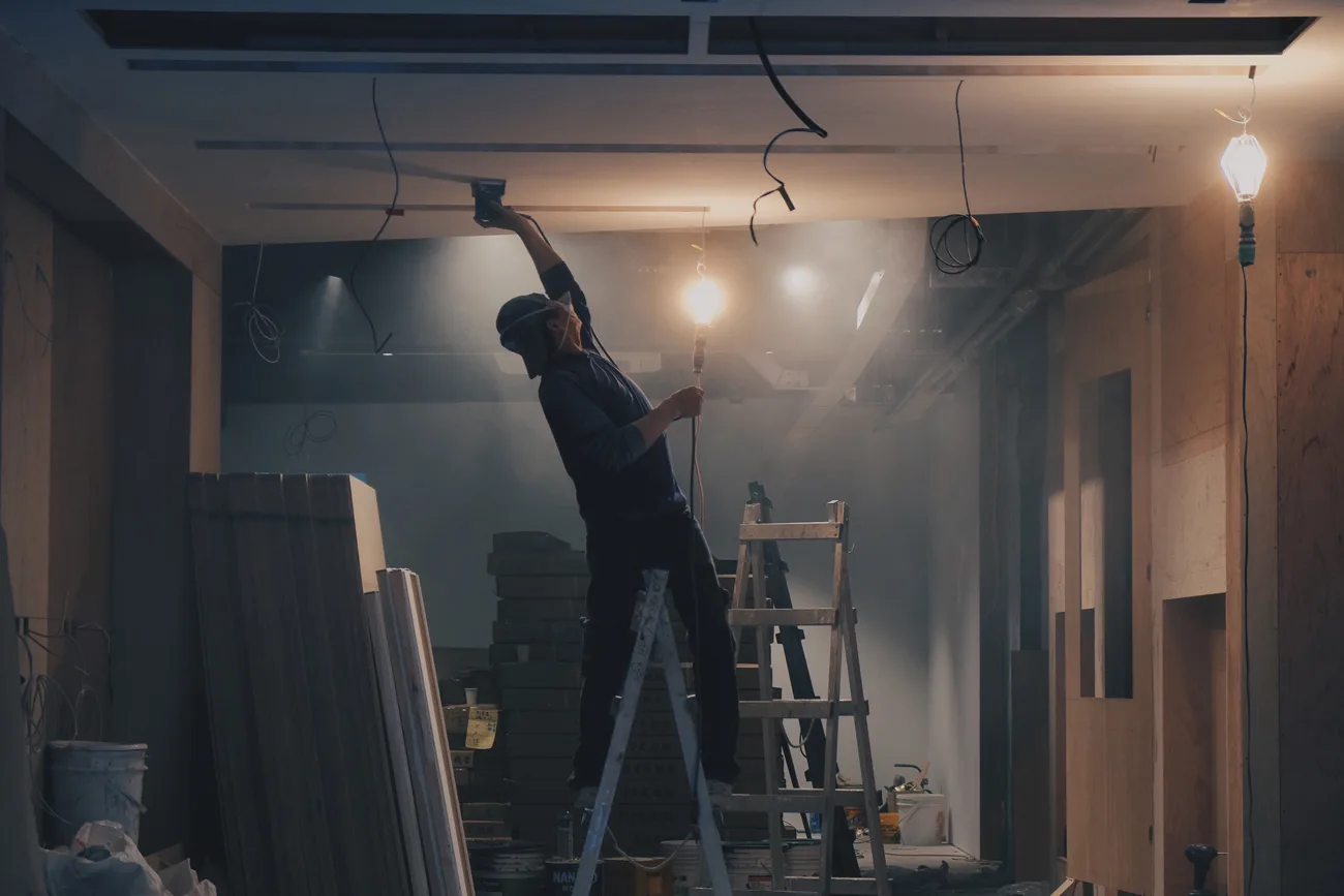 Specialist tradesperson working inside a building under construction